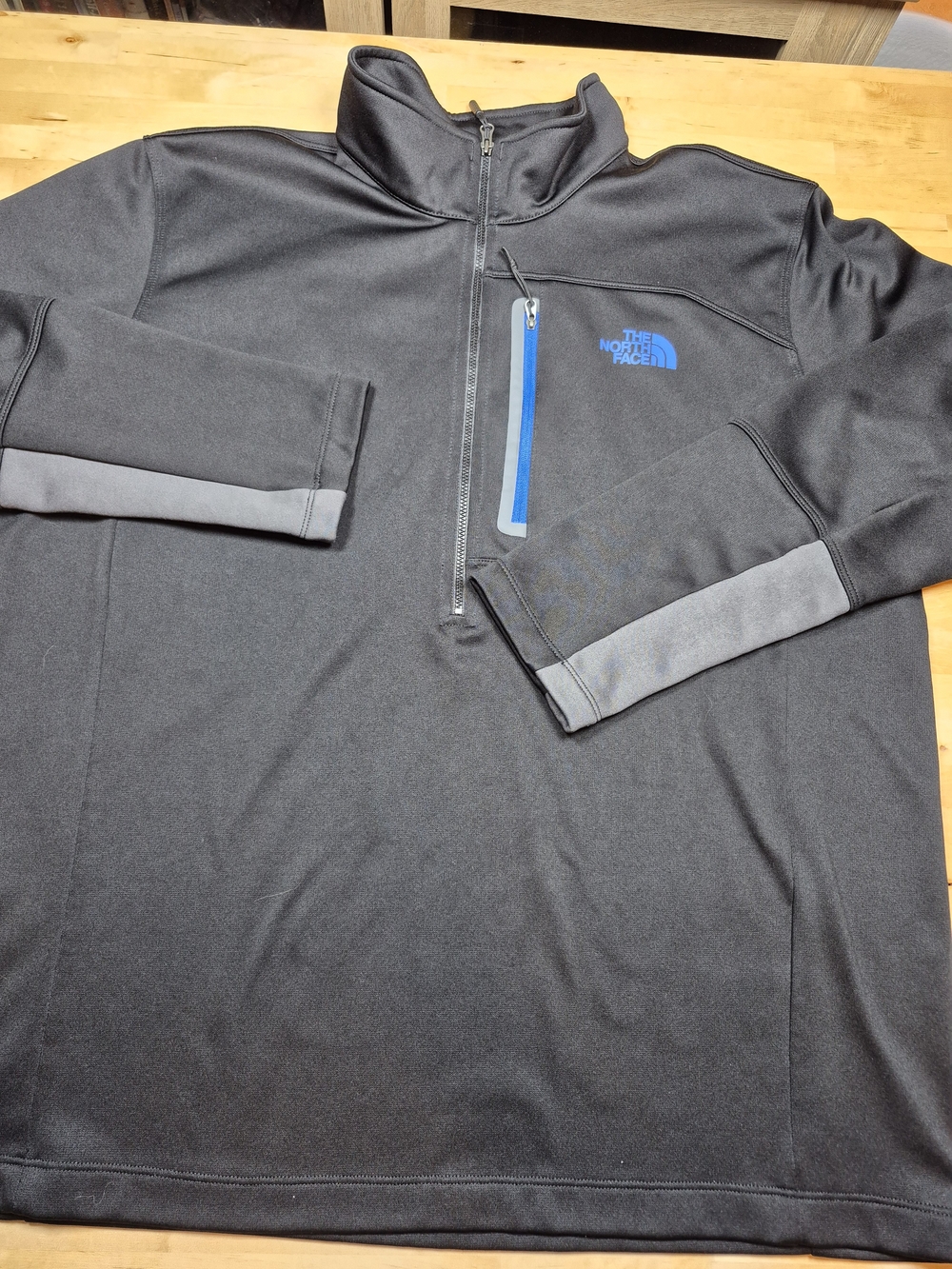 The North Face Men's Black Quarter-Zip Pullover with Blue Logo